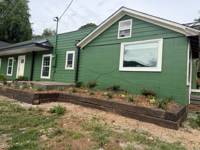 Side exterior and landscaped office entrance